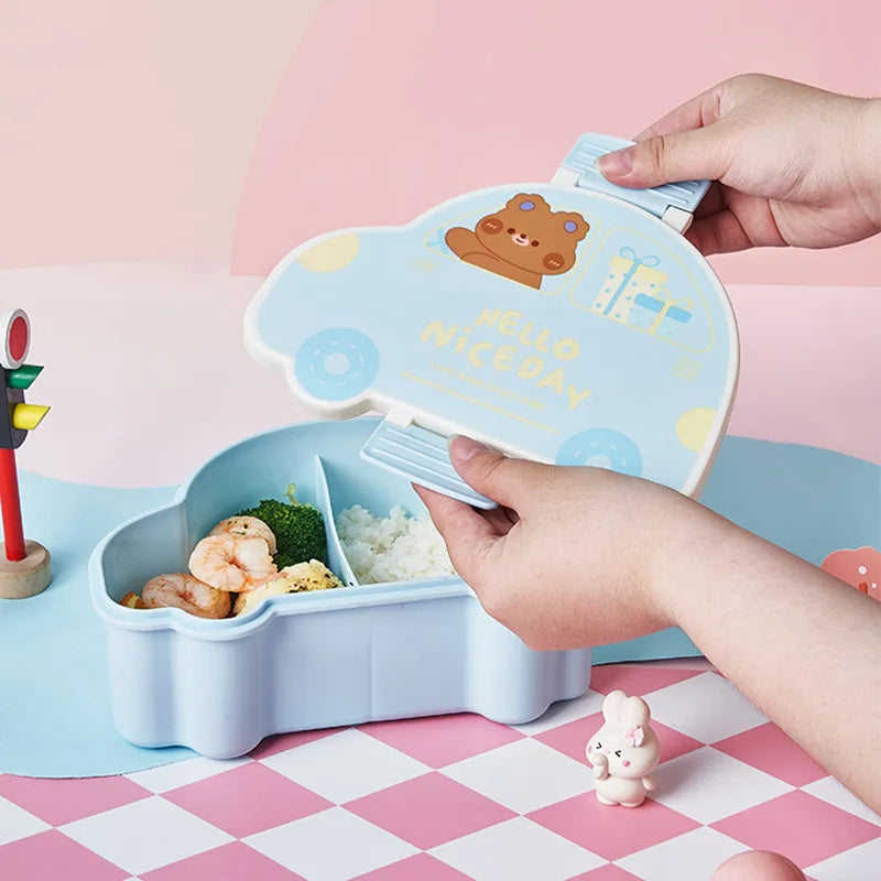 Children's kawaii bento box with cartoon bear design on a pink and white checkered tablecloth.