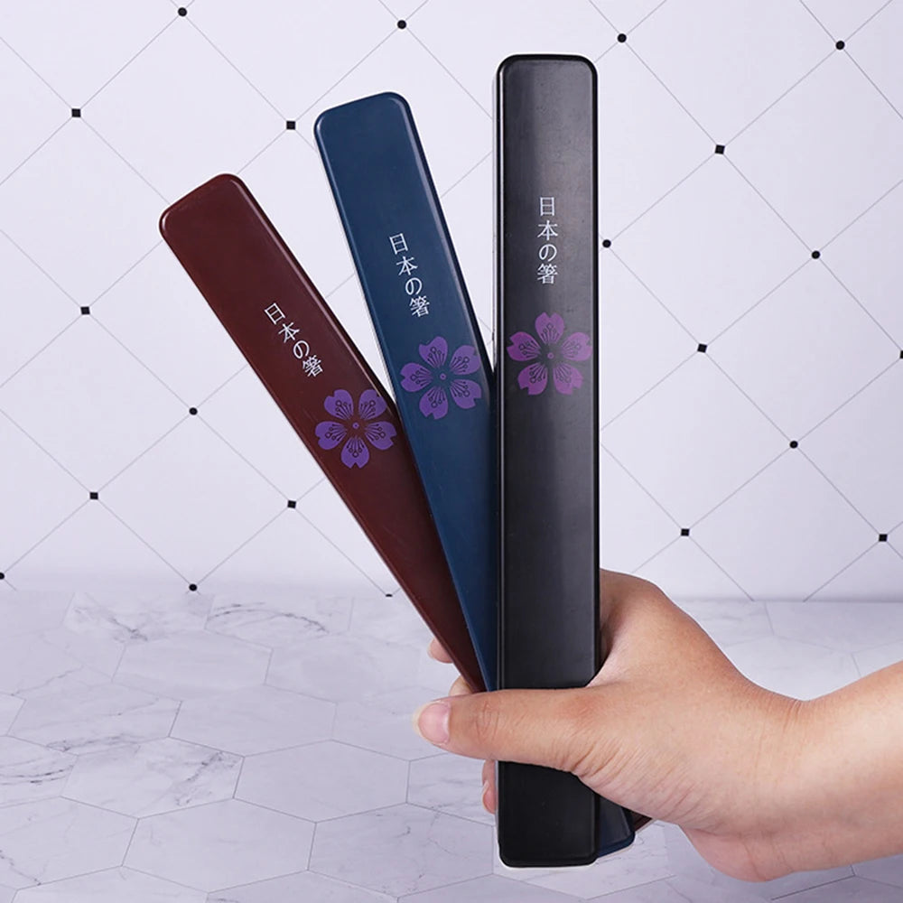 Three kawaii chopsticks with floral designs and text on a white background