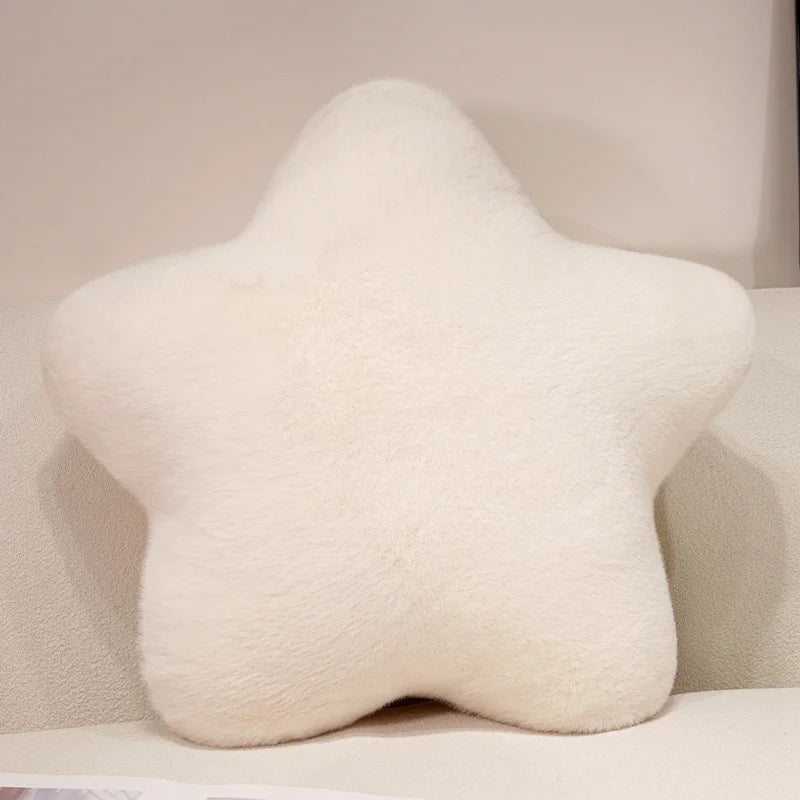 Star-shaped pillow on a light-colored sofa
