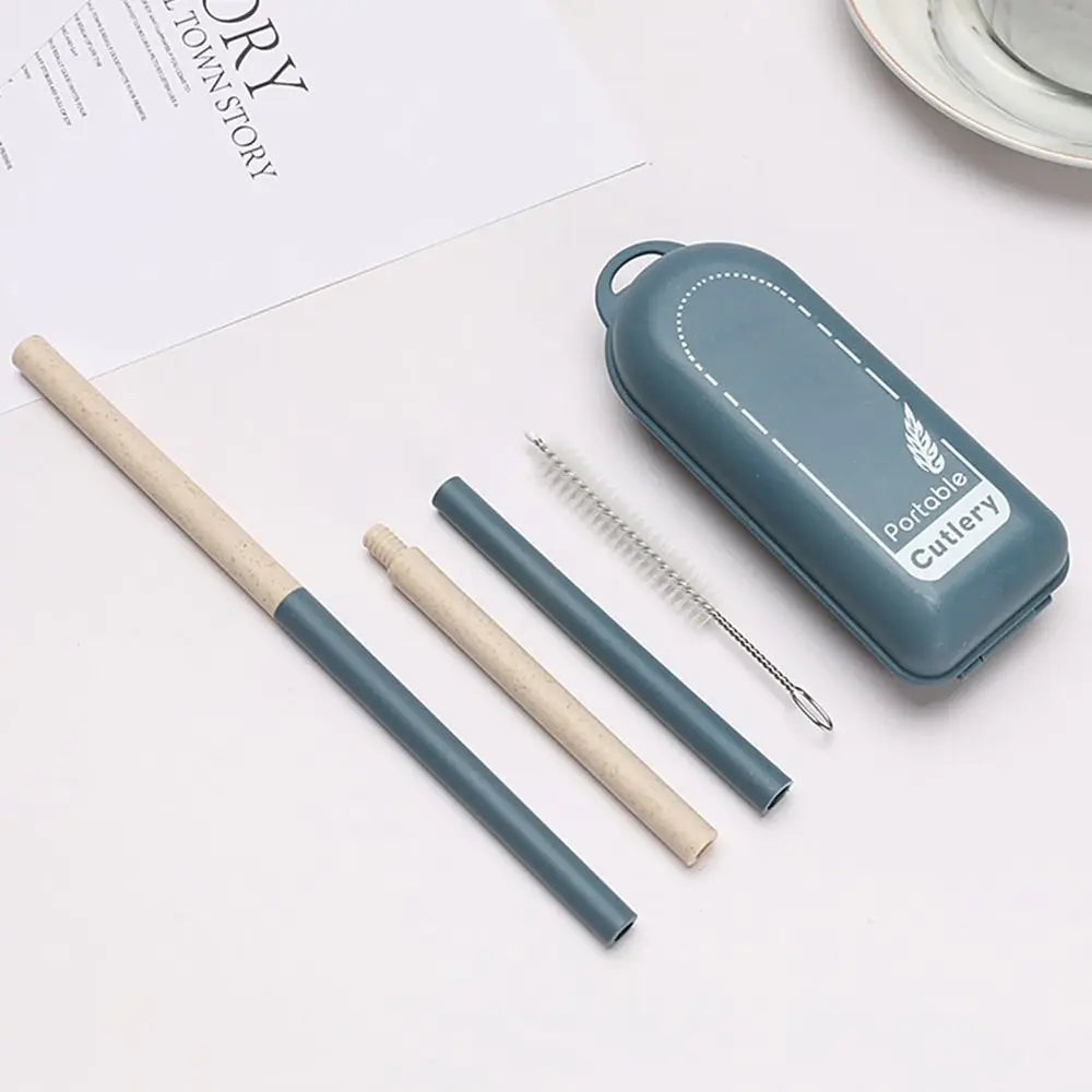 Set of portable kawaii utensils including knives, forks, and spoons in a blue case on a white surface.