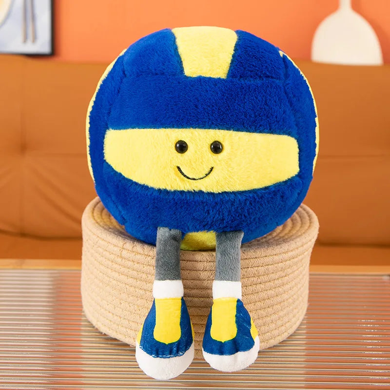 Kawaii plush toy resembling a helmet with a smiling face on a woven basket against an orange wall.