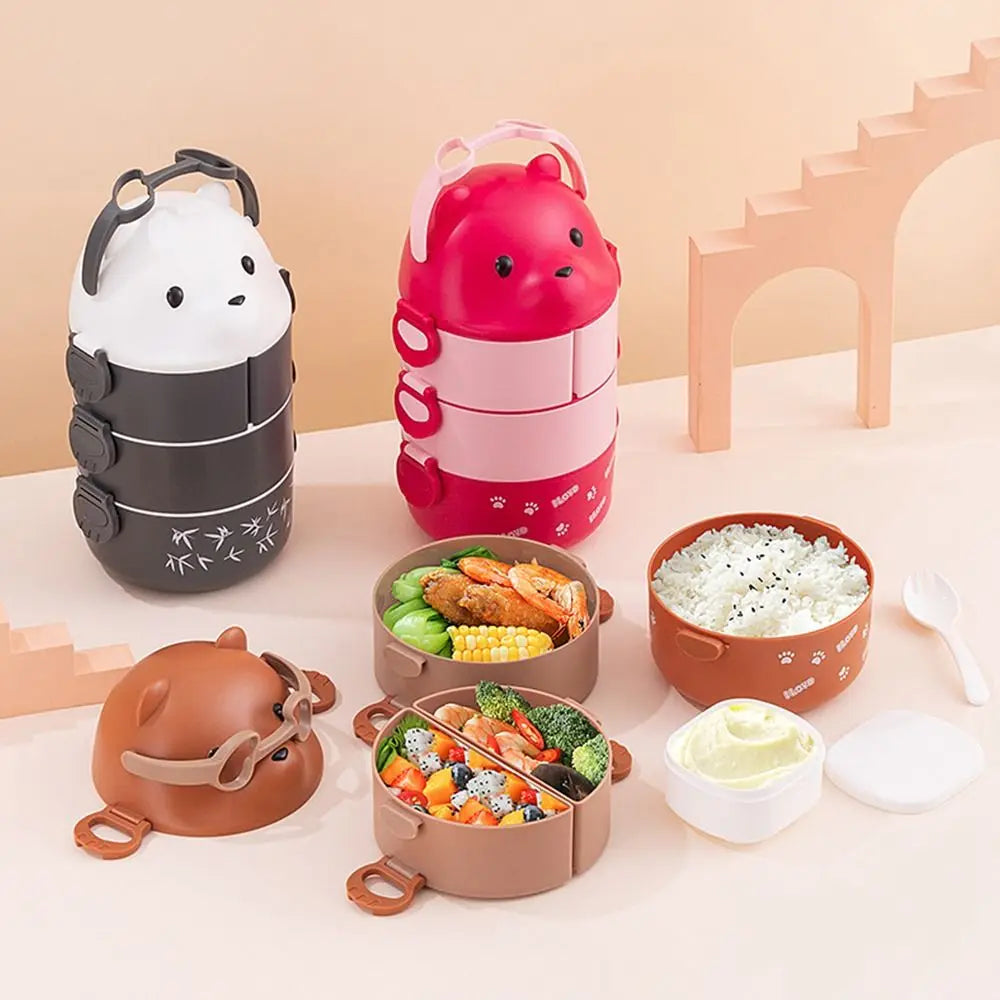 Set of cartoon-themed kawaii bento boxes with food compartments on a light background
