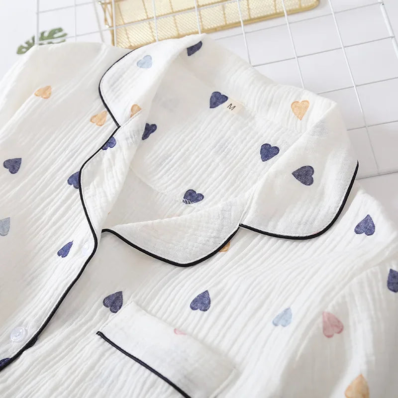 White pajama set with kawaii heart patterns on a white background