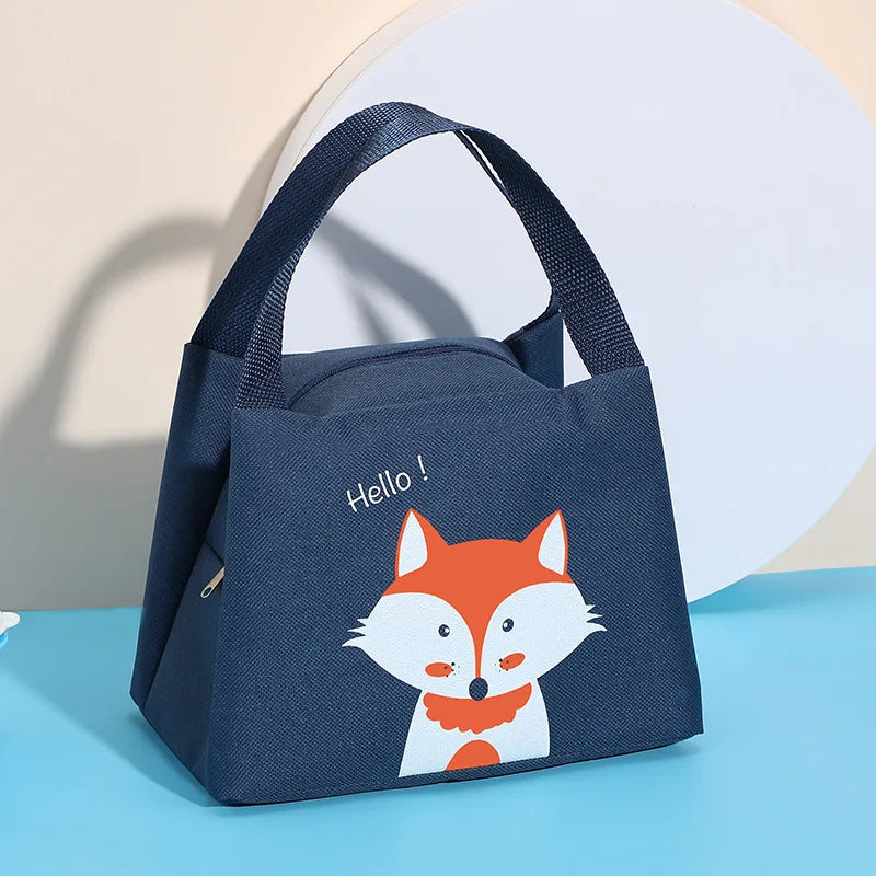 Navy blue kawaii tote bag with a fox illustration and 'Hello!' text on a light blue surface.