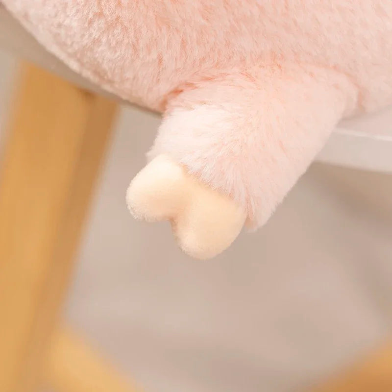 Close-up of a kawaii plush toy's paw with a blurred background