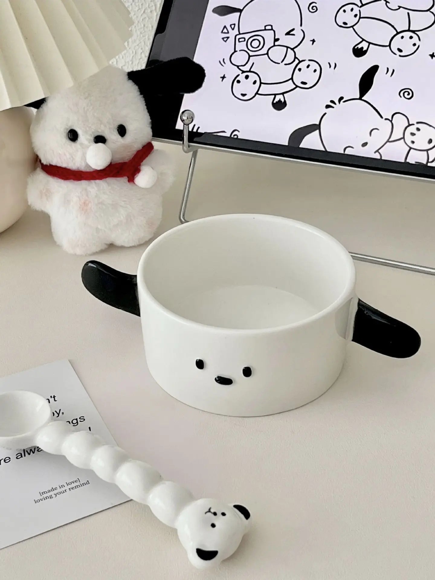 A black and white dog themed kawaii ramen bowl on a table