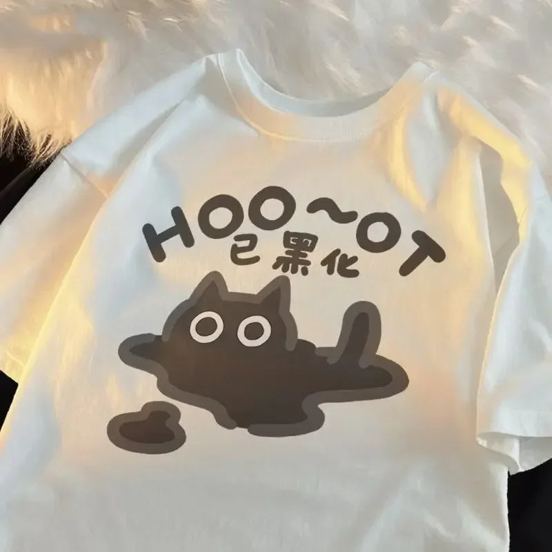 White t-shirt with a kawaii black cat graphic and text on a fluffy white background