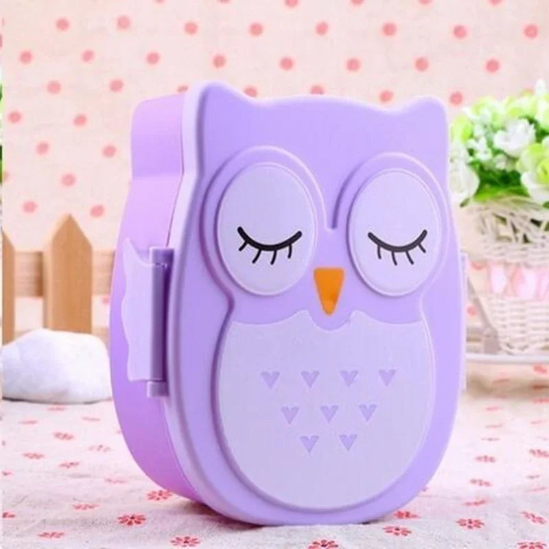 Purple owl-shaped kawaii food container on a polka dot background