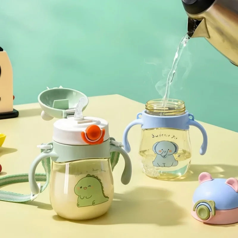 Two kawaii cups with handles, one being filled with water from a kettle, on a light green background.