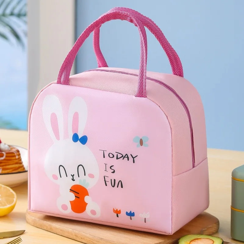 Pink kawaii lunch bag with cartoon bunny design on a table