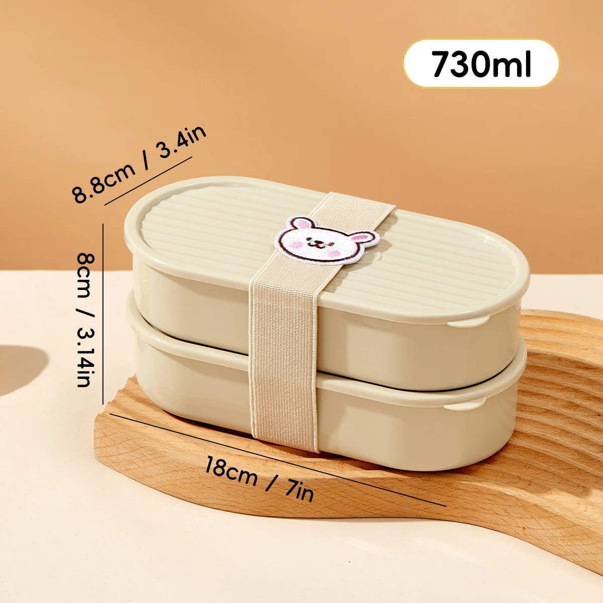 Beige kawaii bento box with a bear design on a wooden stand, showing measurements and capacity.