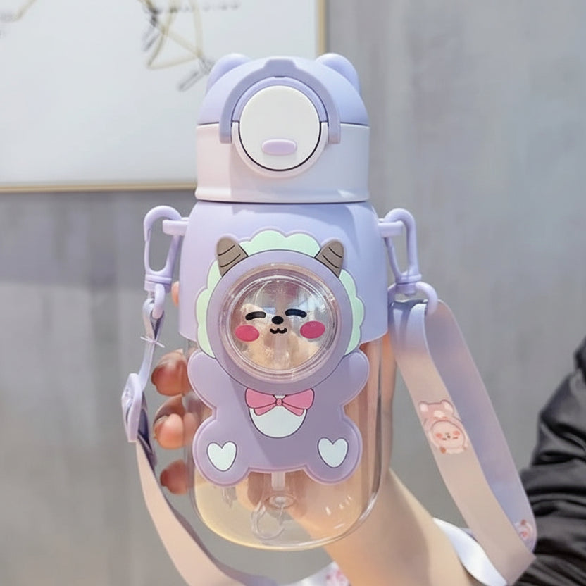 Purple cartoon character kawaii water bottle held by a person with a neutral background