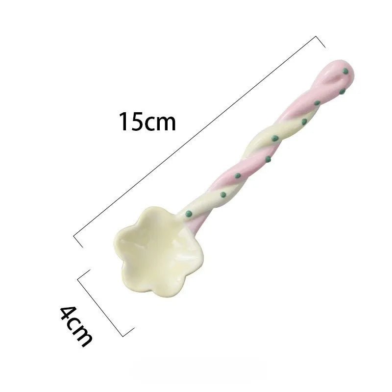 A yellow and pink kawaii spoon on a white background