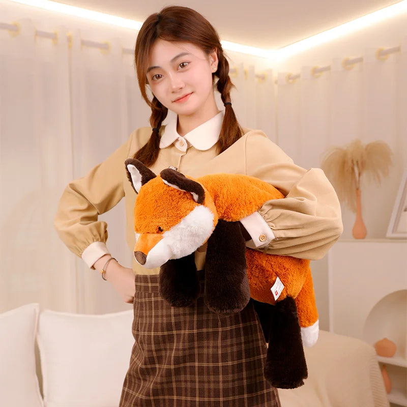 Person holding a kawaii plush fox toy in a cozy indoor setting