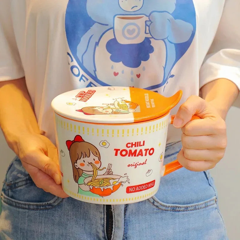 Person holding a kawaii ramen bowl of noodles with cartoon design, wearing a shirt with a similar design.