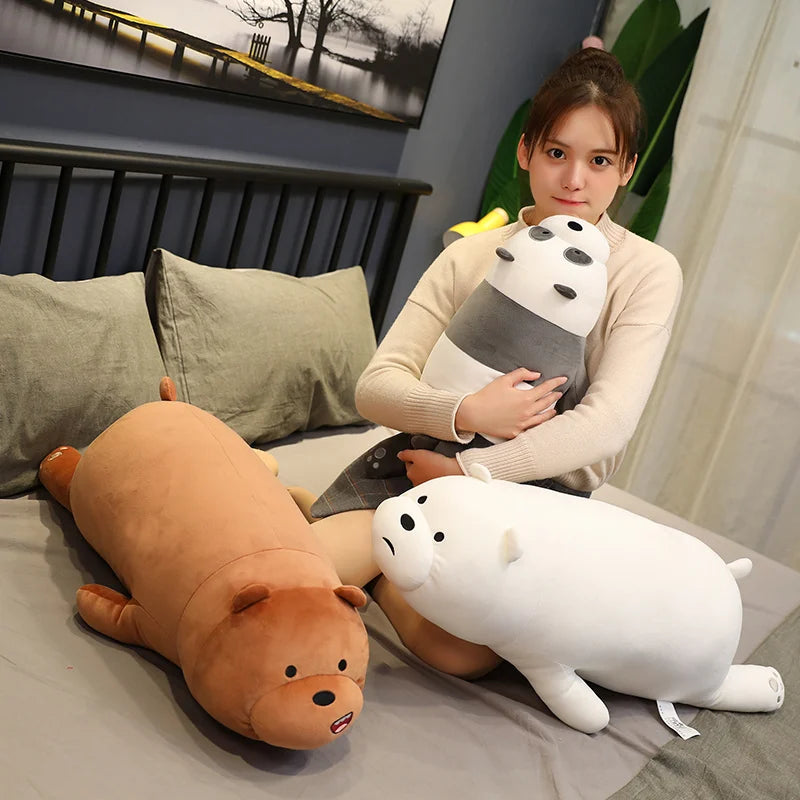 Woman holding a kawaii plush toy on a bed with other plush toys around her.