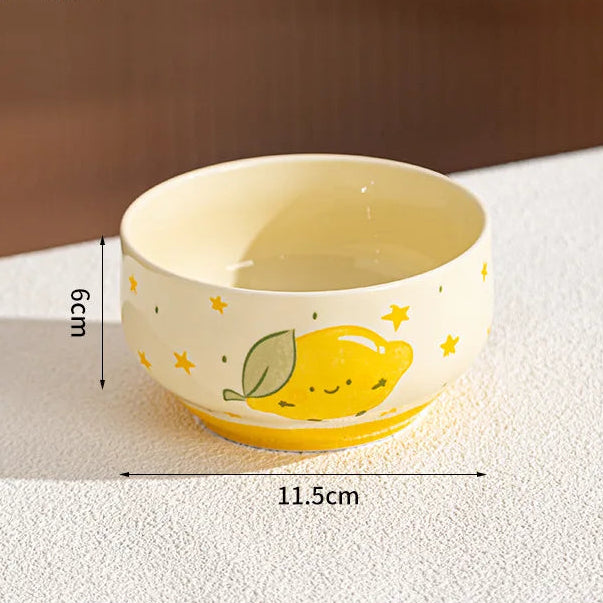 Ceramic kawaii bowl with lemon design and measurements on a textured surface