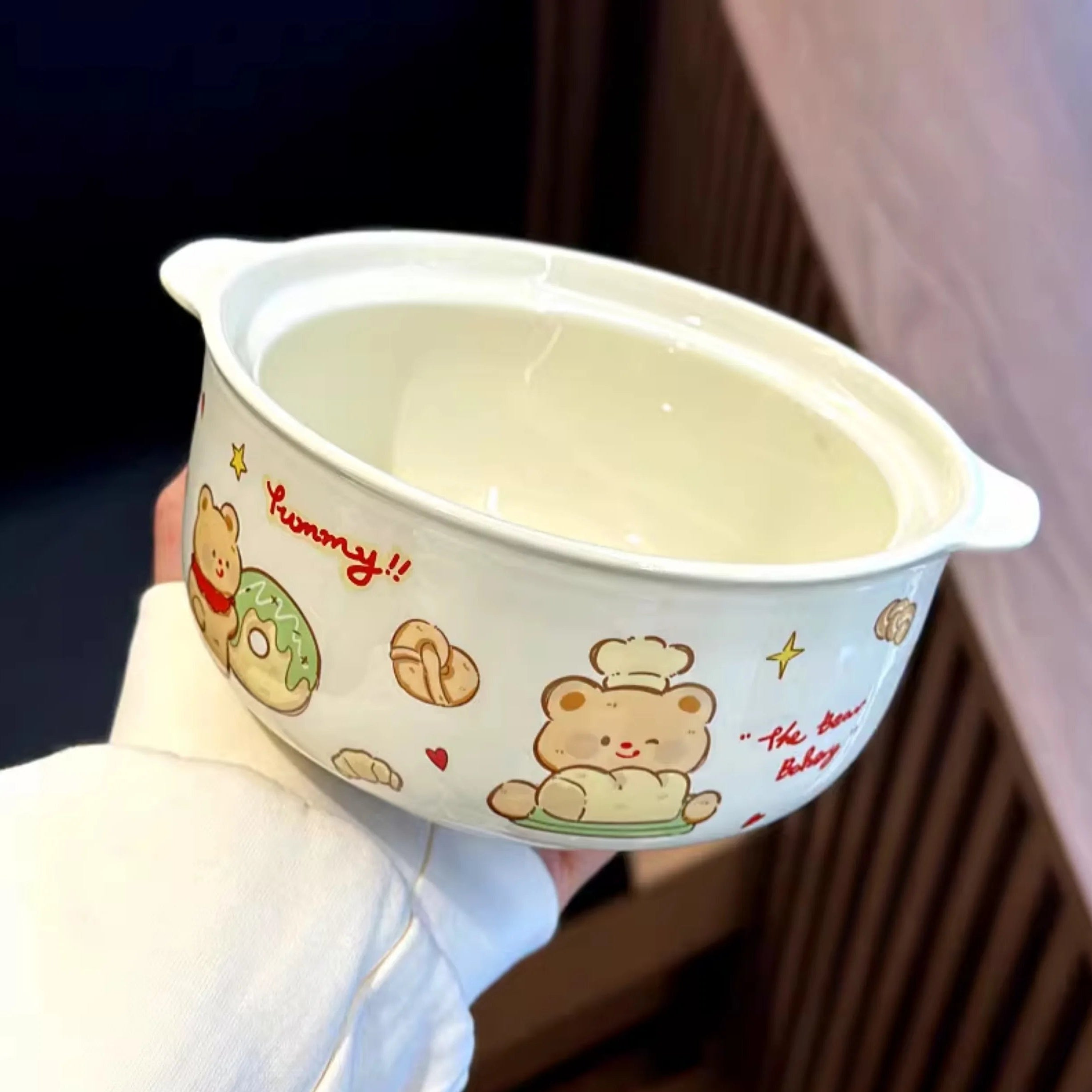 Children's kawaii ramen bowl with cartoon bear design held by a person