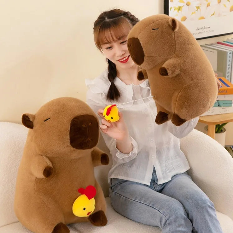 Woman holding two large brown kawaii plush toys on a couch with colorful stars above.