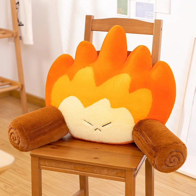 Flame-shaped kawaii cushion with a face on a wooden chair
