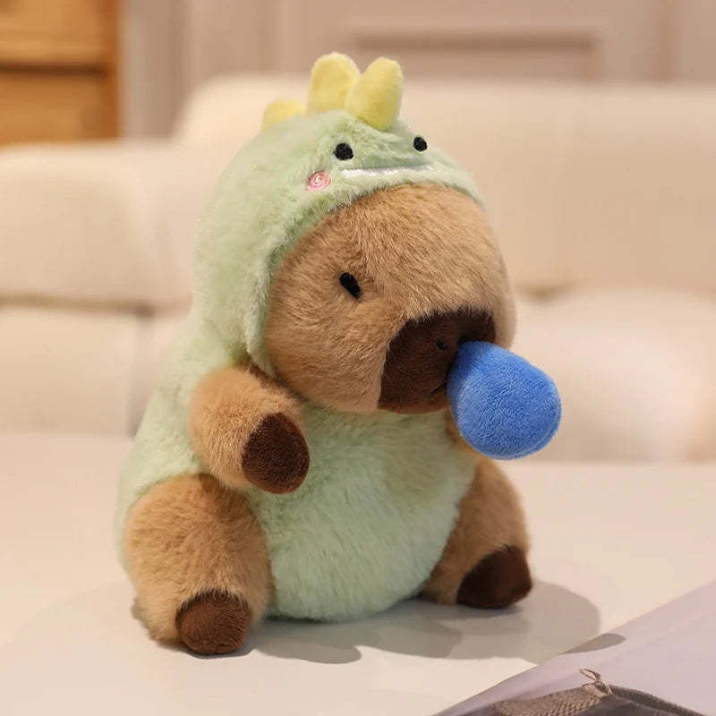 Kawaii plush toy resembling a dinosaur with a blue bubble on a light background