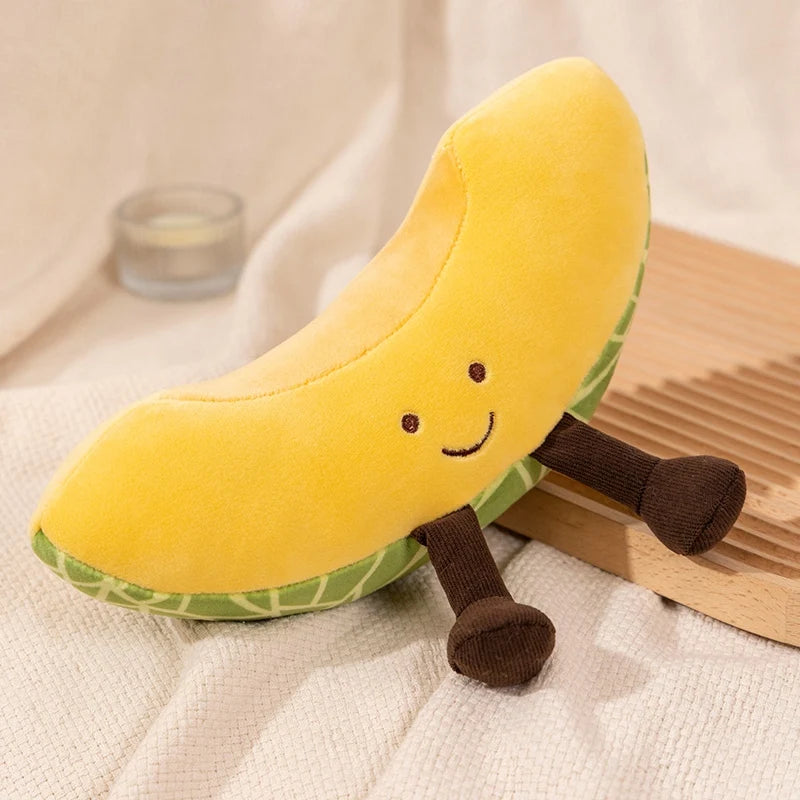 Plush banana toy with a smiley face on a neutral background