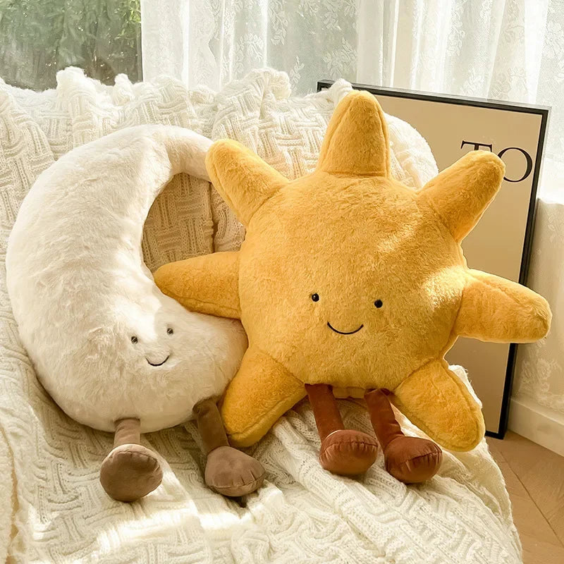 Kawaii plush toys shaped like a star and a circle with a face on a textured surface.
