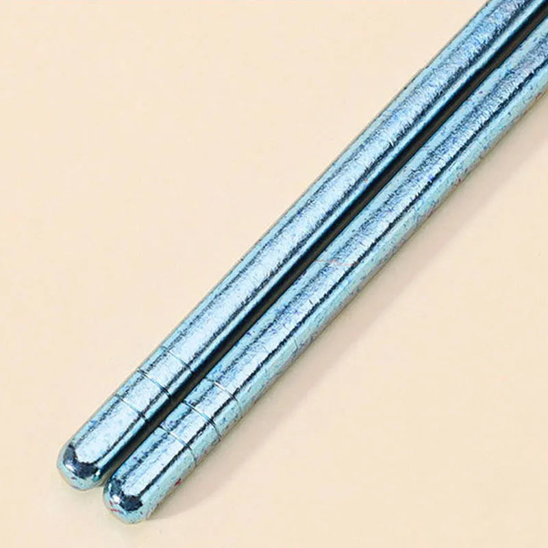 Blue kawaii chopstickson a beige background