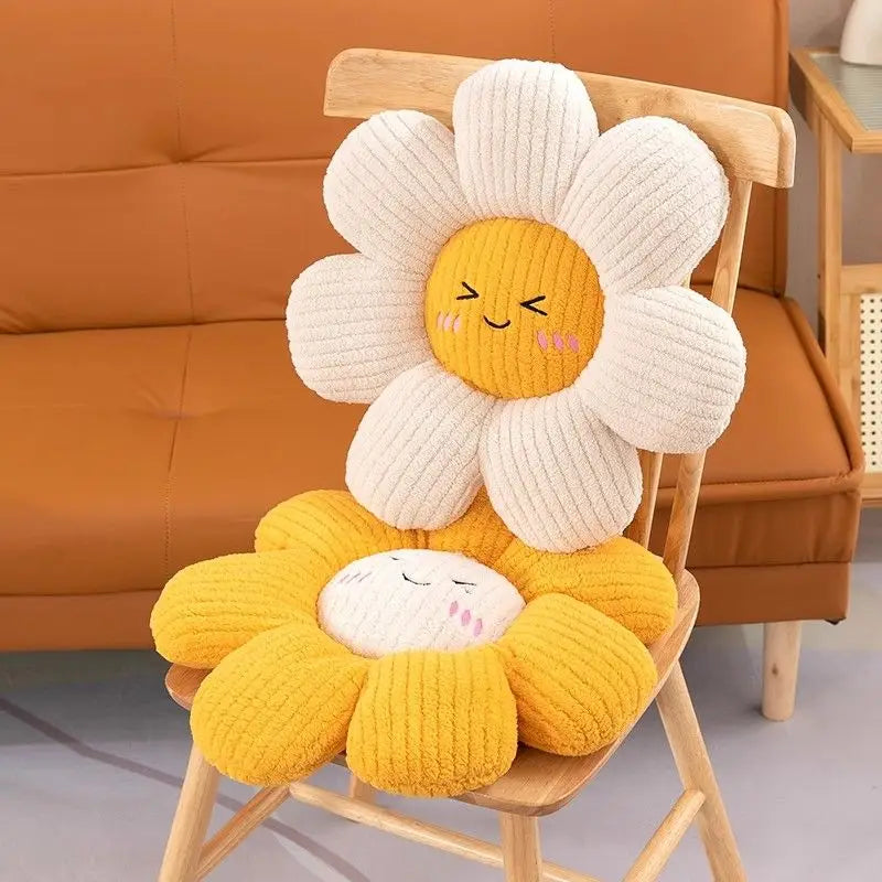 Flower-shaped kawaii cushions with a smiling face on a wooden chair against an orange sofa background