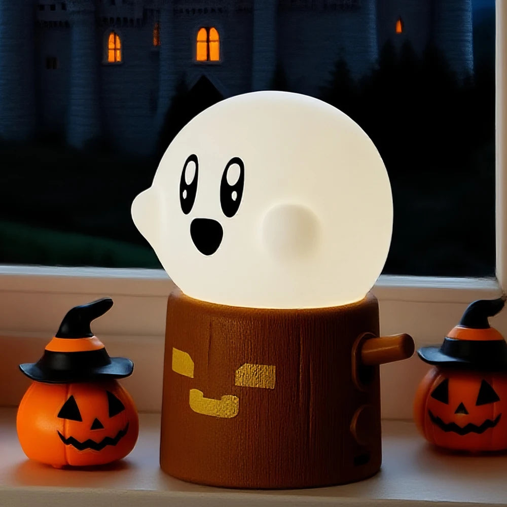 Halloween-themed kawaii ghost lamp with pumpkins on a windowsill.