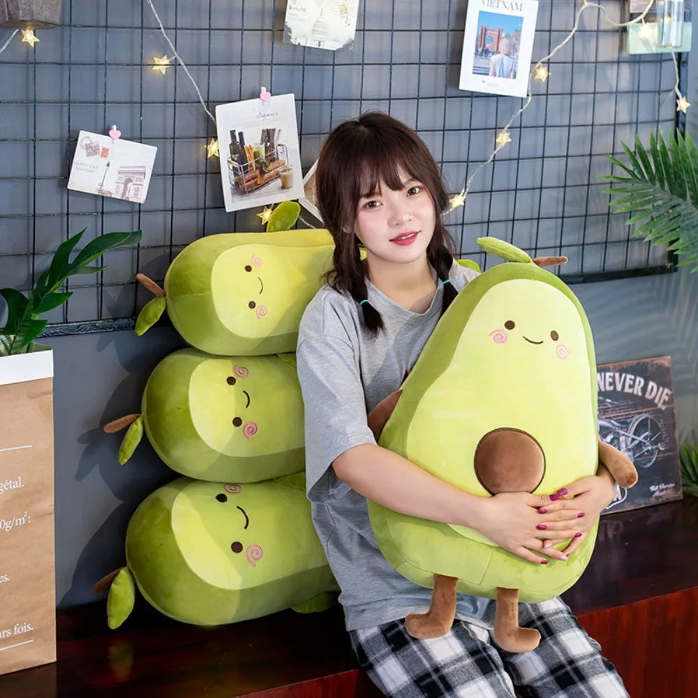 Woman holding a large avocado-shaped kawaii plush toy in a room with decorative elements.