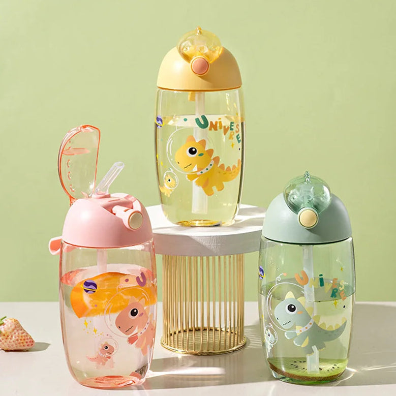 Three colorful children's kawaii water bottles with animal designs on a light green background