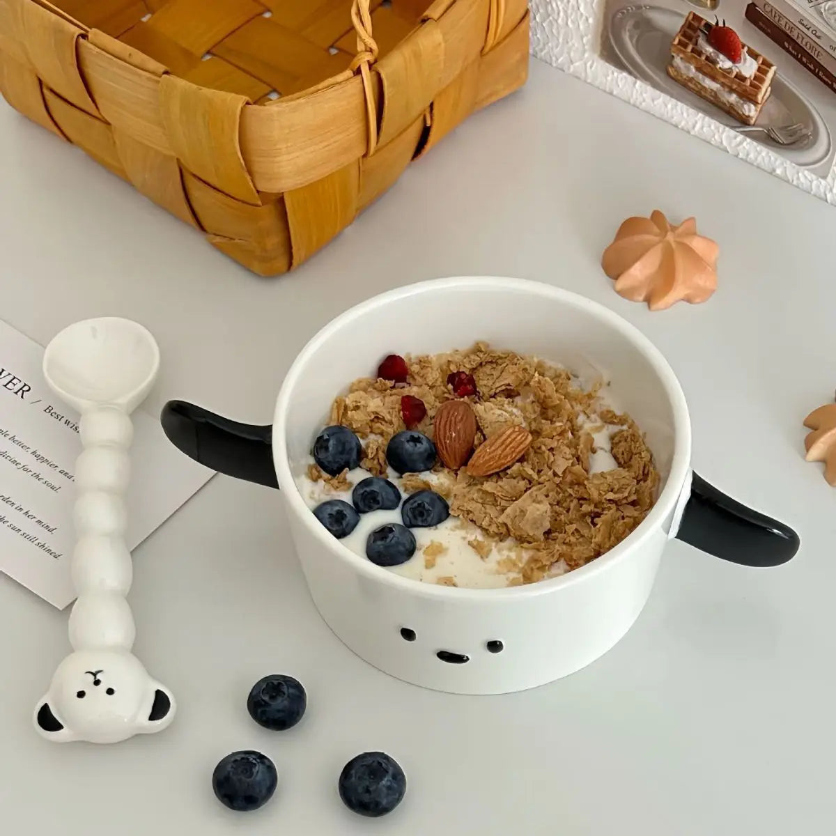 A dog themed kawaii ramen bowl with cereal inside it and spoon next