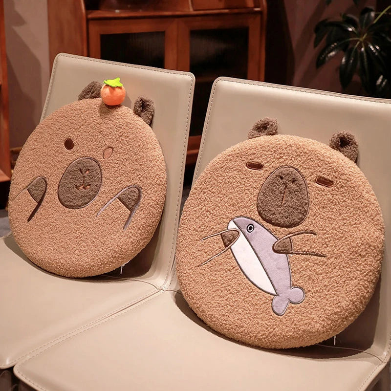 Two round, beige pouches with animal kawaii designs on a white surface.