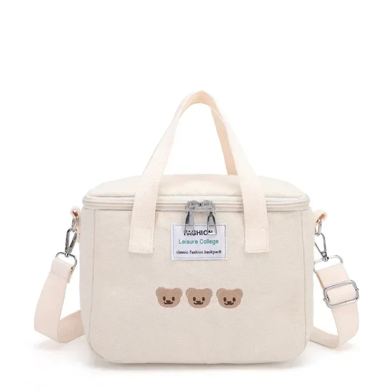 Beige kawaii lunch bag with teddy bear embroidery on a white background