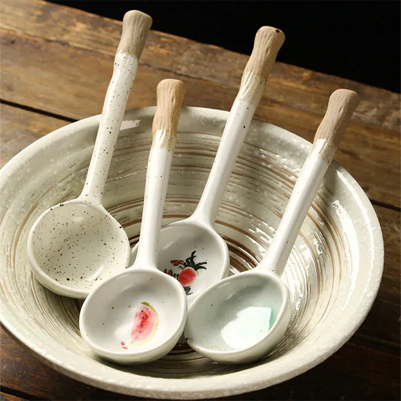 Four white kawaii spoons sitting inside a bowl