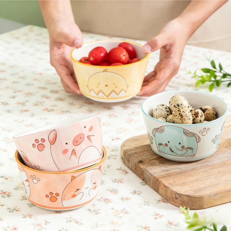 Four kawaii bowls sitting on the kitchen table
