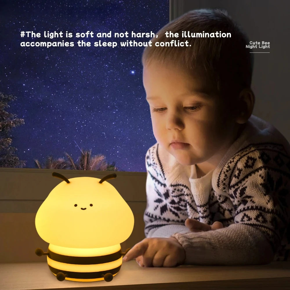 Child interacting with a bee-shaped kawaii night light under a starry sky.