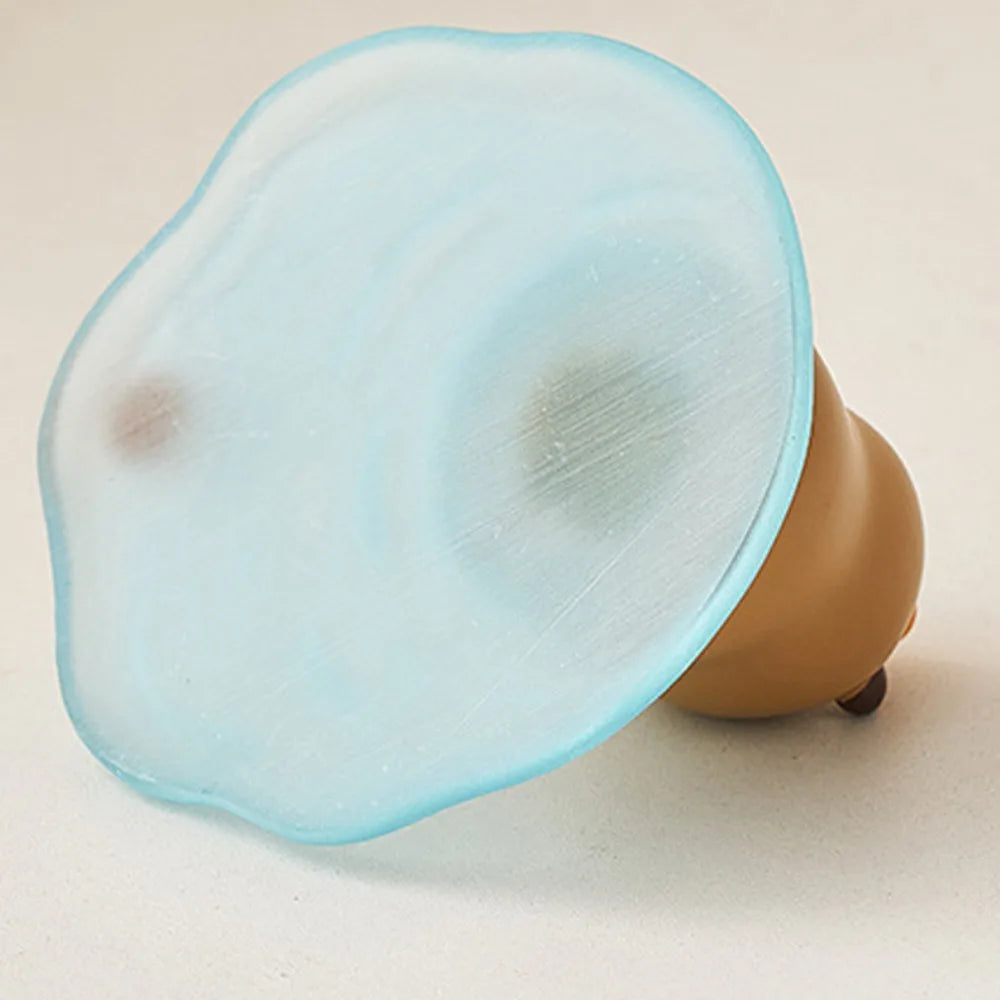 Blue silicone cone-shaped of a kawaii phone holder on a beige background