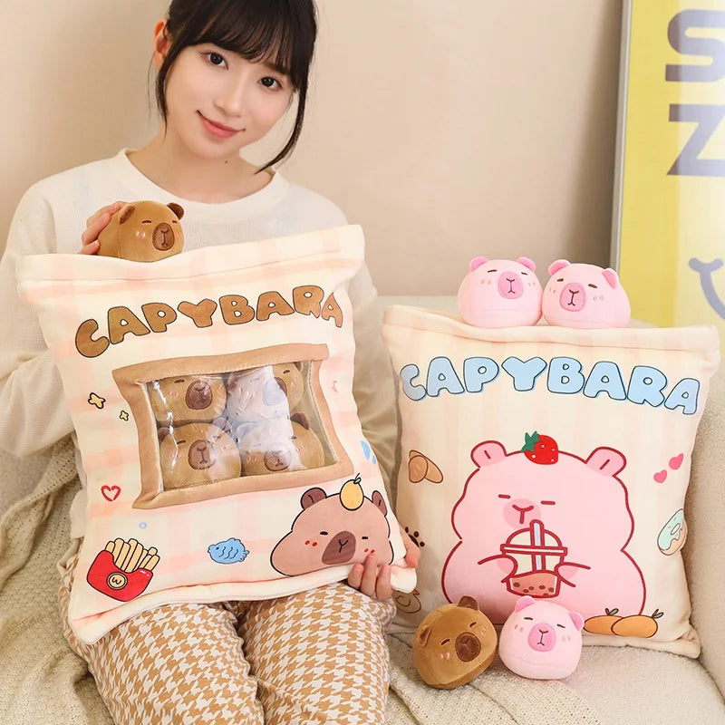Person holding a capybara-themed kawaii pillow with plush toys on a couch.