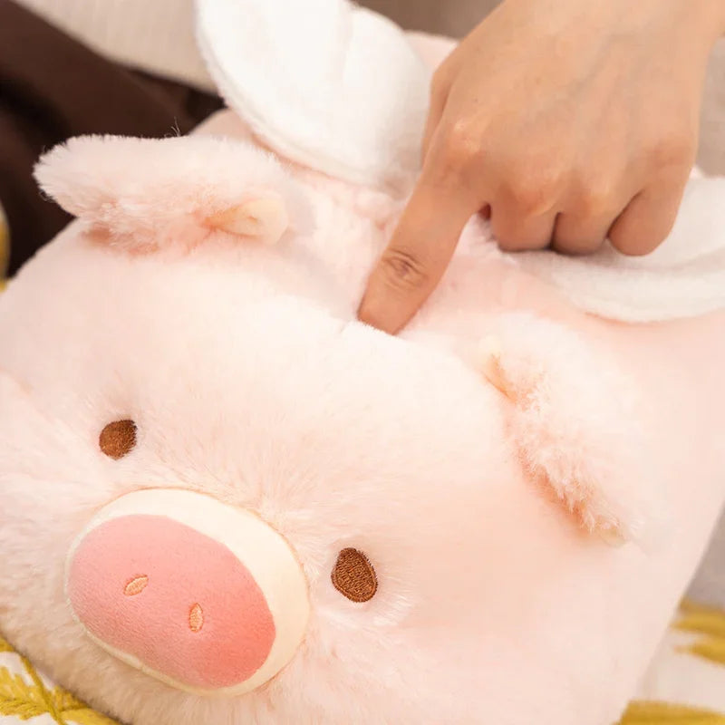 Close-up of a kawaii plush pig toy being petted by a hand