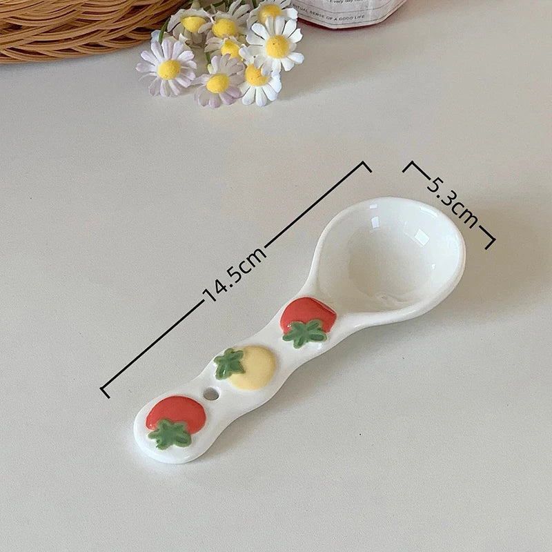 A white ceramic kawaii spoon on a table