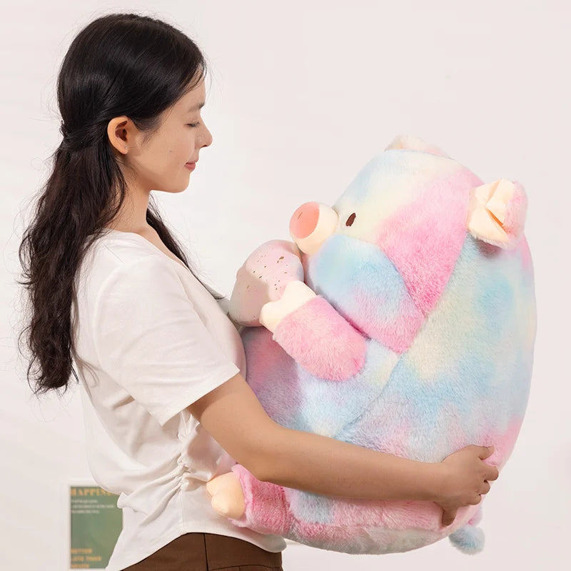 A woman holding a hugh kawaii pig plush toy
