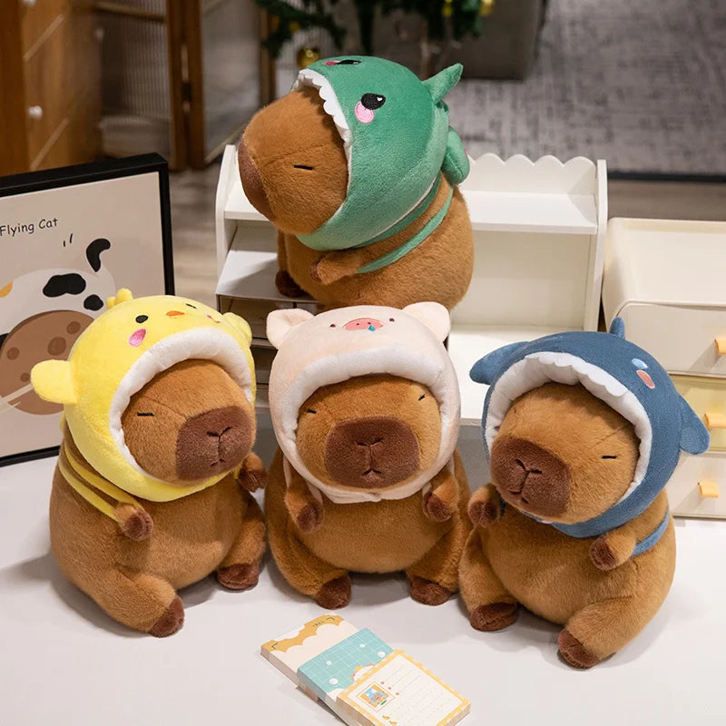 Four brown kawaii plush toys with colorful hats on a white surface.