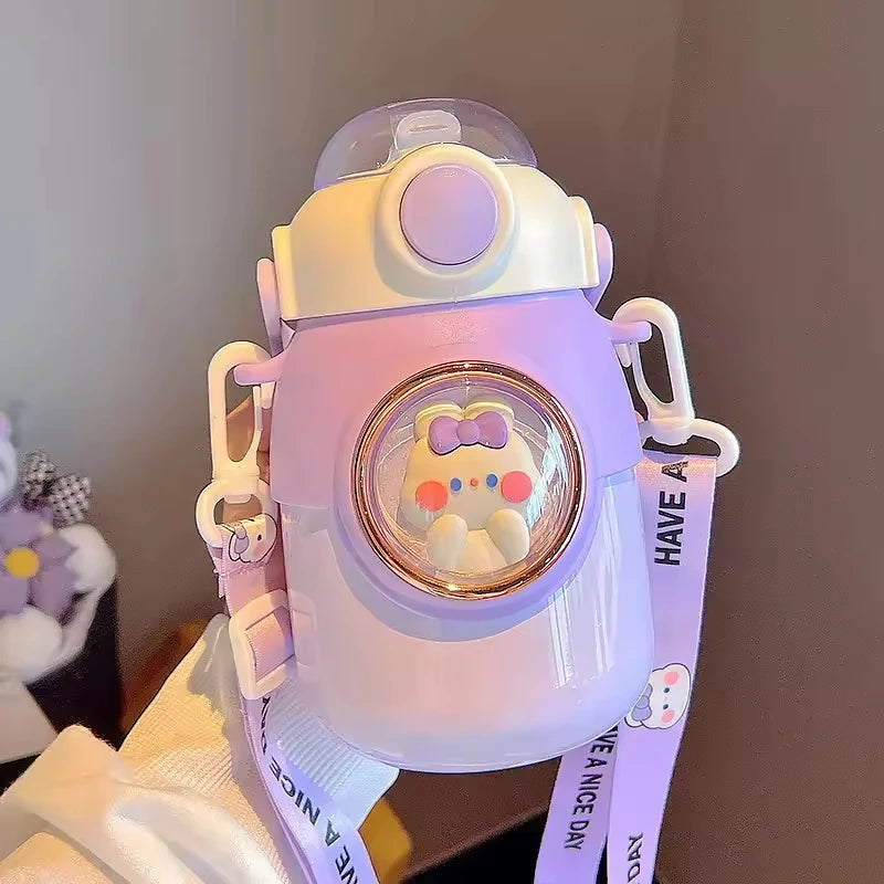 Cute kawaii water bottle with cartoon character design on a strap against a neutral background