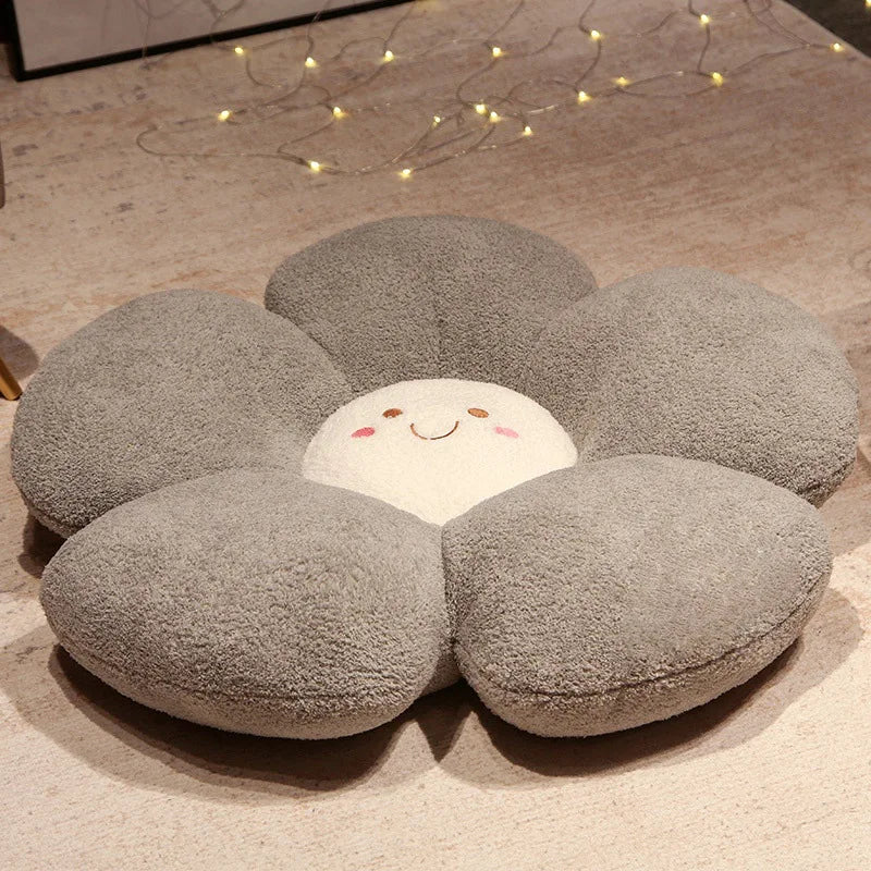 Flower-shaped kawaii cushion with a smiling face on a beige carpet
