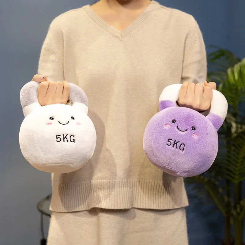Person holding two kawaii plush dumbbells, one white and one purple, with '5KG' marking.