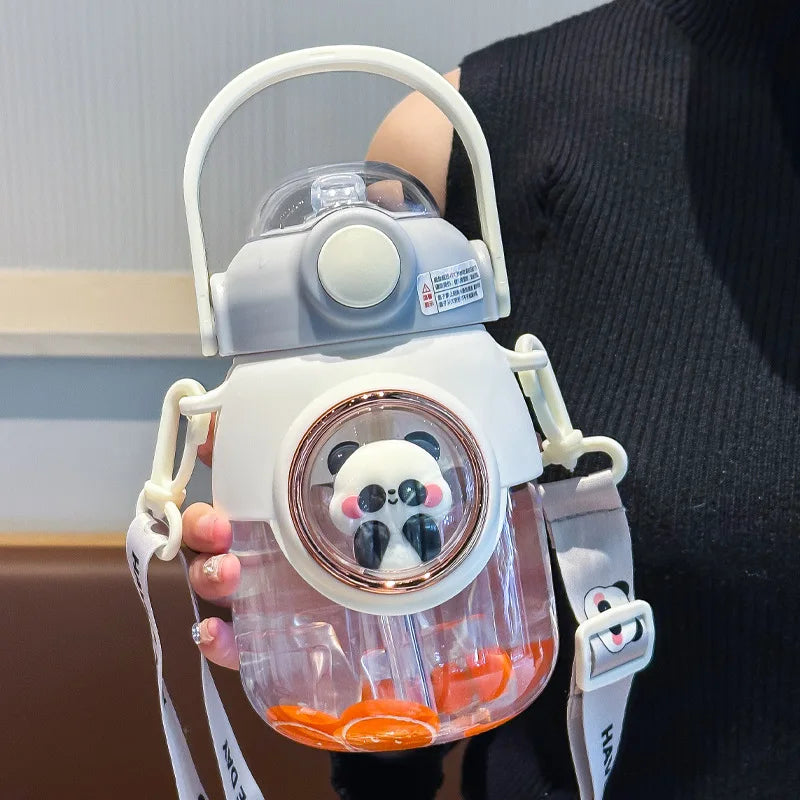 Clear kawaii water bottle with panda design and white handle held by a person