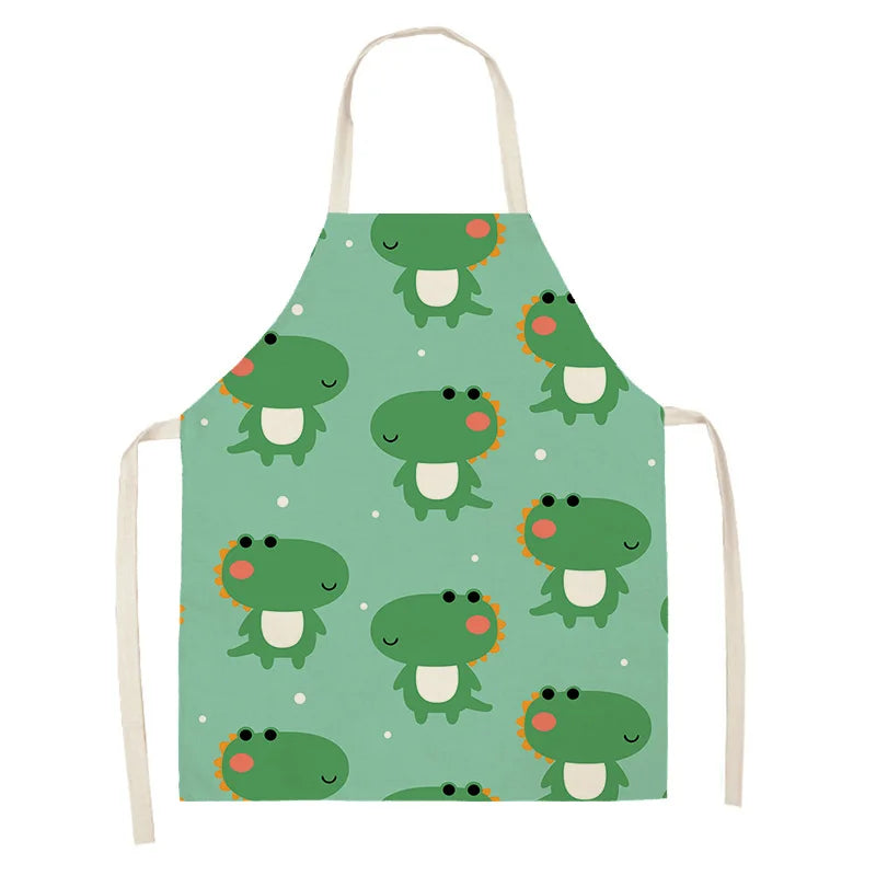 Children's kawaii apron with dinosaur pattern on a green background