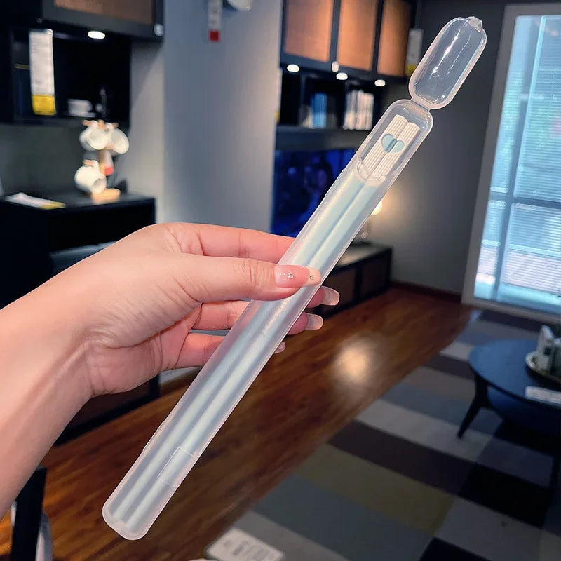 A kawaii chopsticks by a hand in an indoor setting
